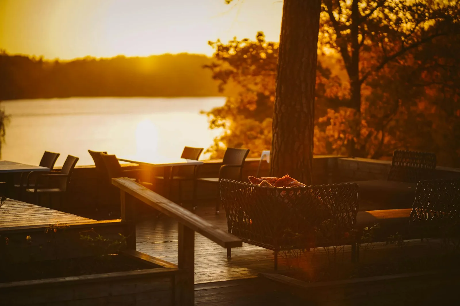 Sundowner cocktails on the lodge deck at golden hour